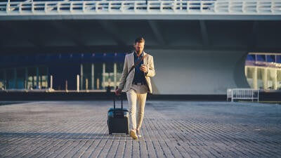 Traveller using mobile phone