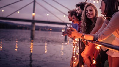Holidaymakers drinking alcohol on a boat