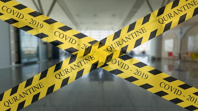 Quarantine and Covid-19 yellow warning tape