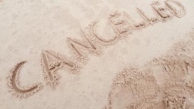 'Cancelled' written on the beach