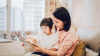 Mother and daughter using tablet