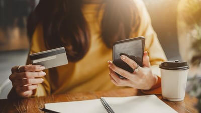 woman phone finances