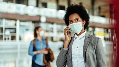 business traveller following health and safety protocols