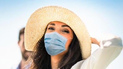 Woman on vacation with mask
