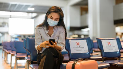 Woman in mask at airport