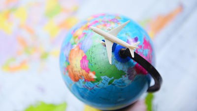 Plane going around globe
