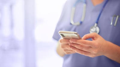 Nurse holding phone