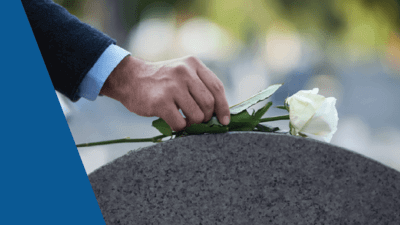 flower on headstone at funeral