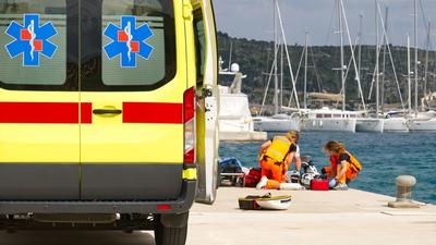 ambulance and medical crew providing assistance at harbourside