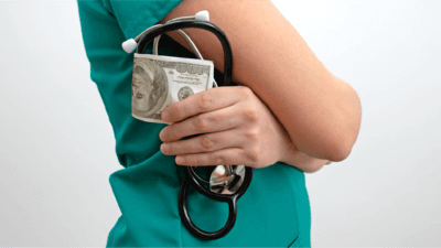 Doctor holding money