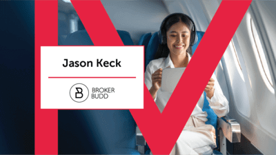Person using iPad on a airplane 