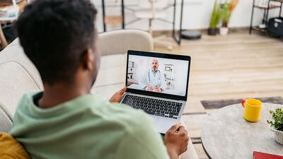 Telehealth patient at home talking to doctor