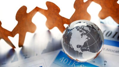Concept imagery of cut out people and globe