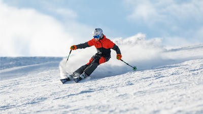 Image of someone skiing down a slope