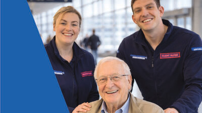 2 doctors helping a patient
