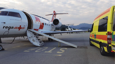Air ambulance on a runway with an ambulance