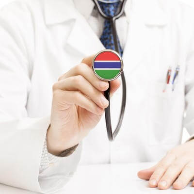 Dr with stethoscope with Gambia flag