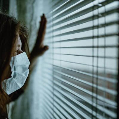 Woman on lockdown at home