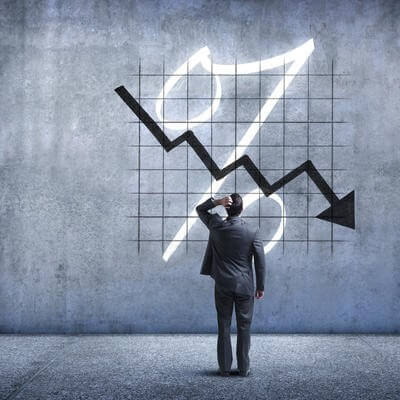 A businessman looks on helplessly as deal rates plummet