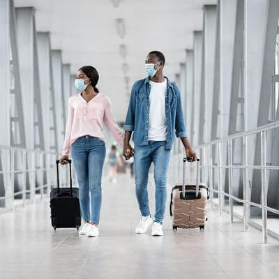 Couple at airport with masks