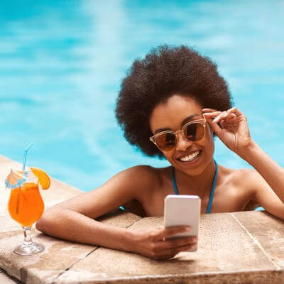 woman in pool wiht smartphone