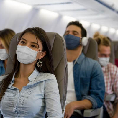 Masked passenger on plane