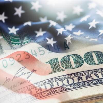 American US flag with 100 dollar bill superimposed