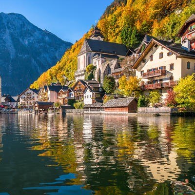 An Austrian lake with mountains and a village on the shore
