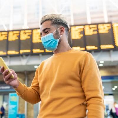 Person at airport with phone