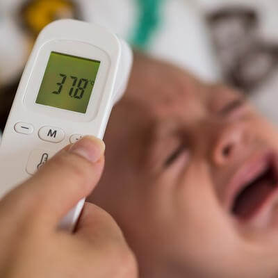 Baby getting temperature read