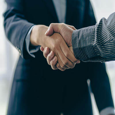 Image of men shaking hands