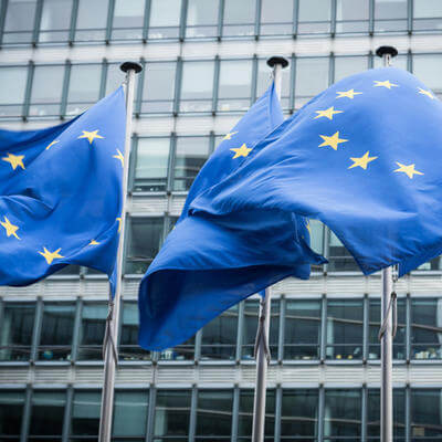 Image of European Union flags outside building