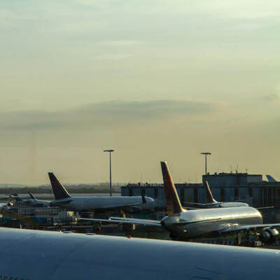 Image of multiple planes on the ground at an airport