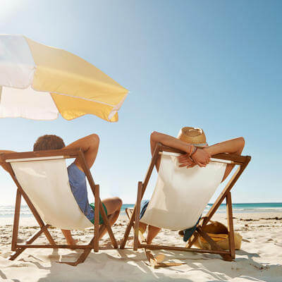 Image of family on beach in the sun
