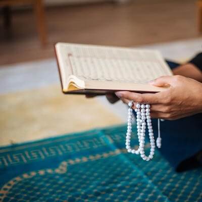 Image of prayer book and beads