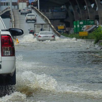 Image of flooded road with cars