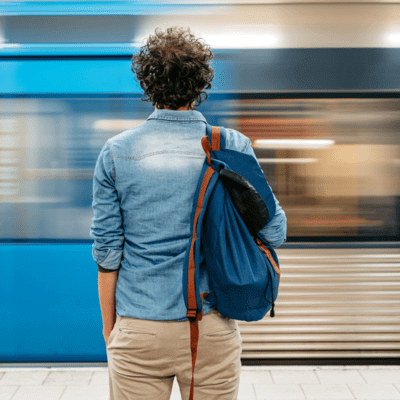 Person looking out at a underground train going past 