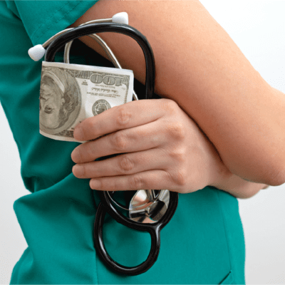 Doctor holding money