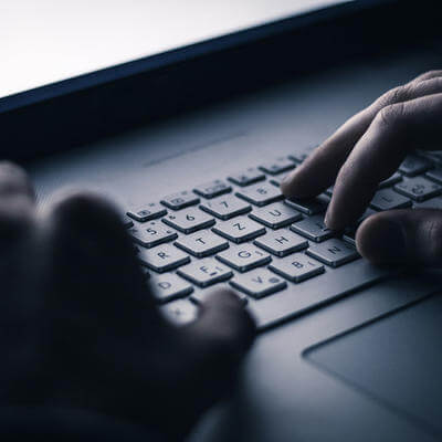 Image of person on laptop