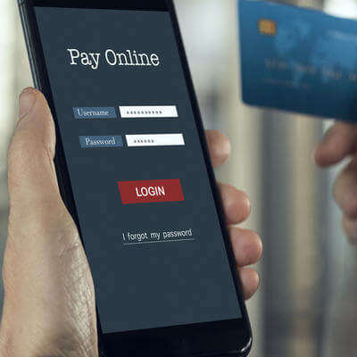 Image of holidaymaker booking tickets on smartphone