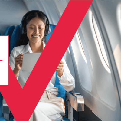 Person using iPad on a airplane 