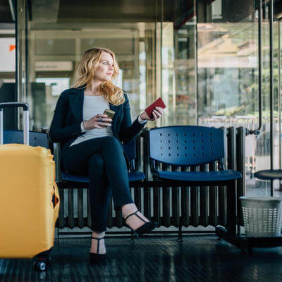 Image of woman sat at airport