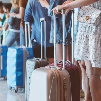 Suitcases airport travellers