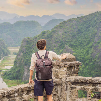 Image of traveller in mountainous landscape