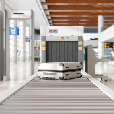 Image of baggage going through airport security