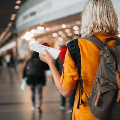 Woman at airport preparing for travel