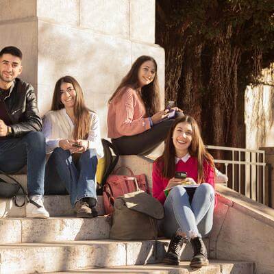 Group of students sitting on steps 