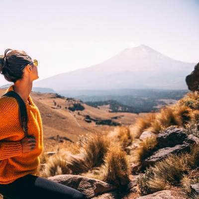 Young Latin woman enjoying the view to Popocatepetl volcano