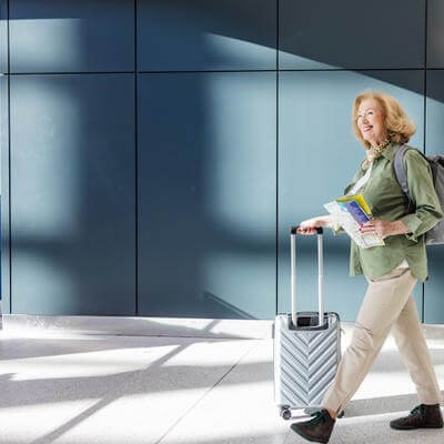 Older lady travelling with suitcase