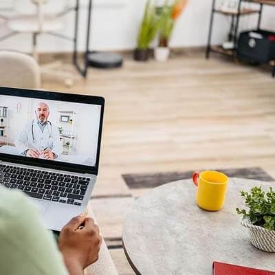 Telehealth patient at home talking to doctor